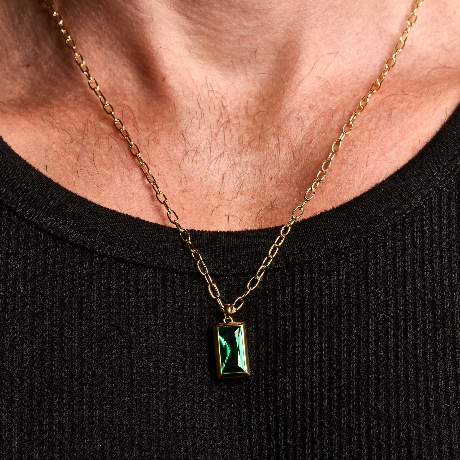 Closeup shot man wearing  Emerald Gold Sona Pendant