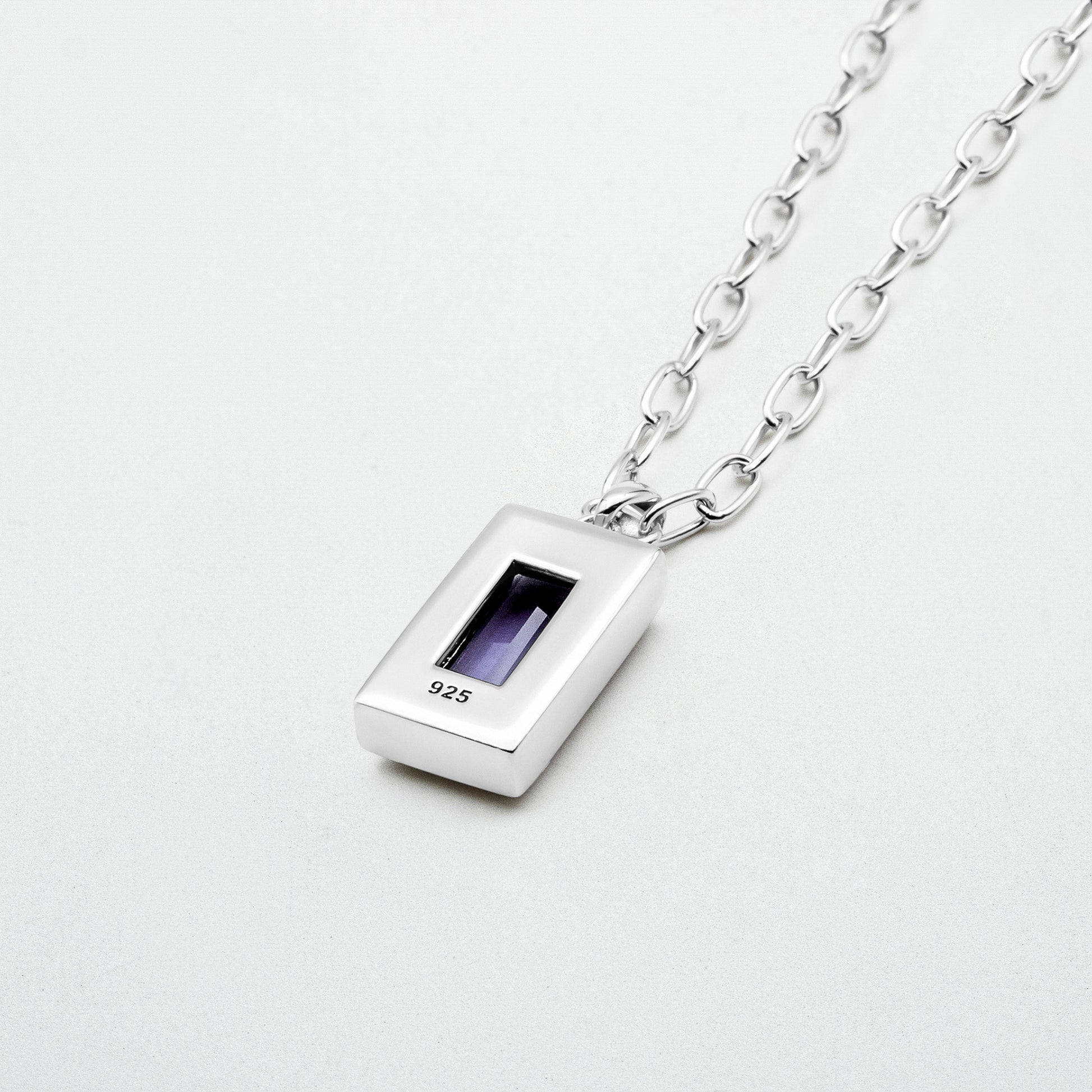 Amethyst Pendant featuring a natural baguette-cut amethyst stone set in rhodium-plated sterling silver, hanging from a 55cm sterling silver chain.