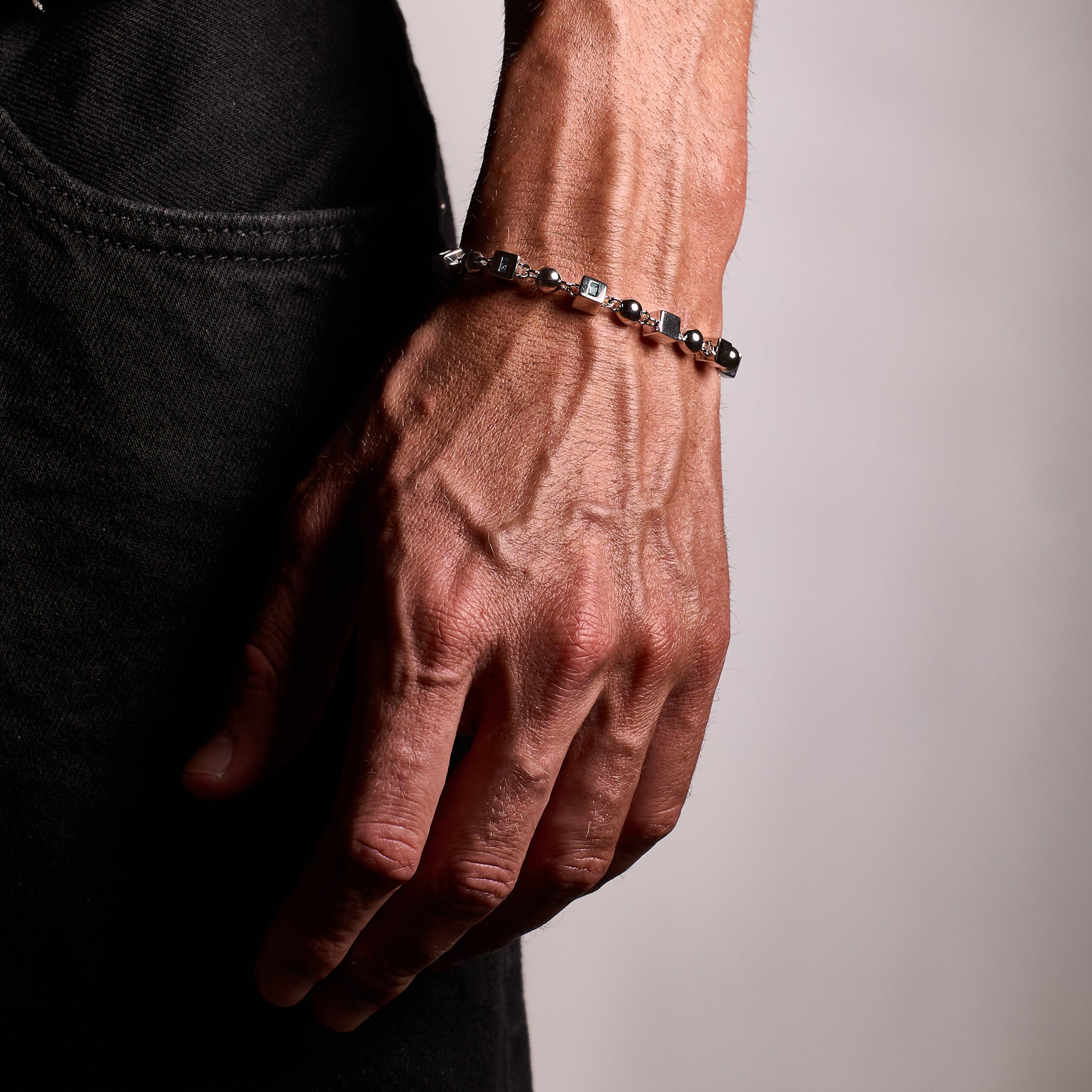 Closeup shot of man wearing Topaz Bracelet on wrist