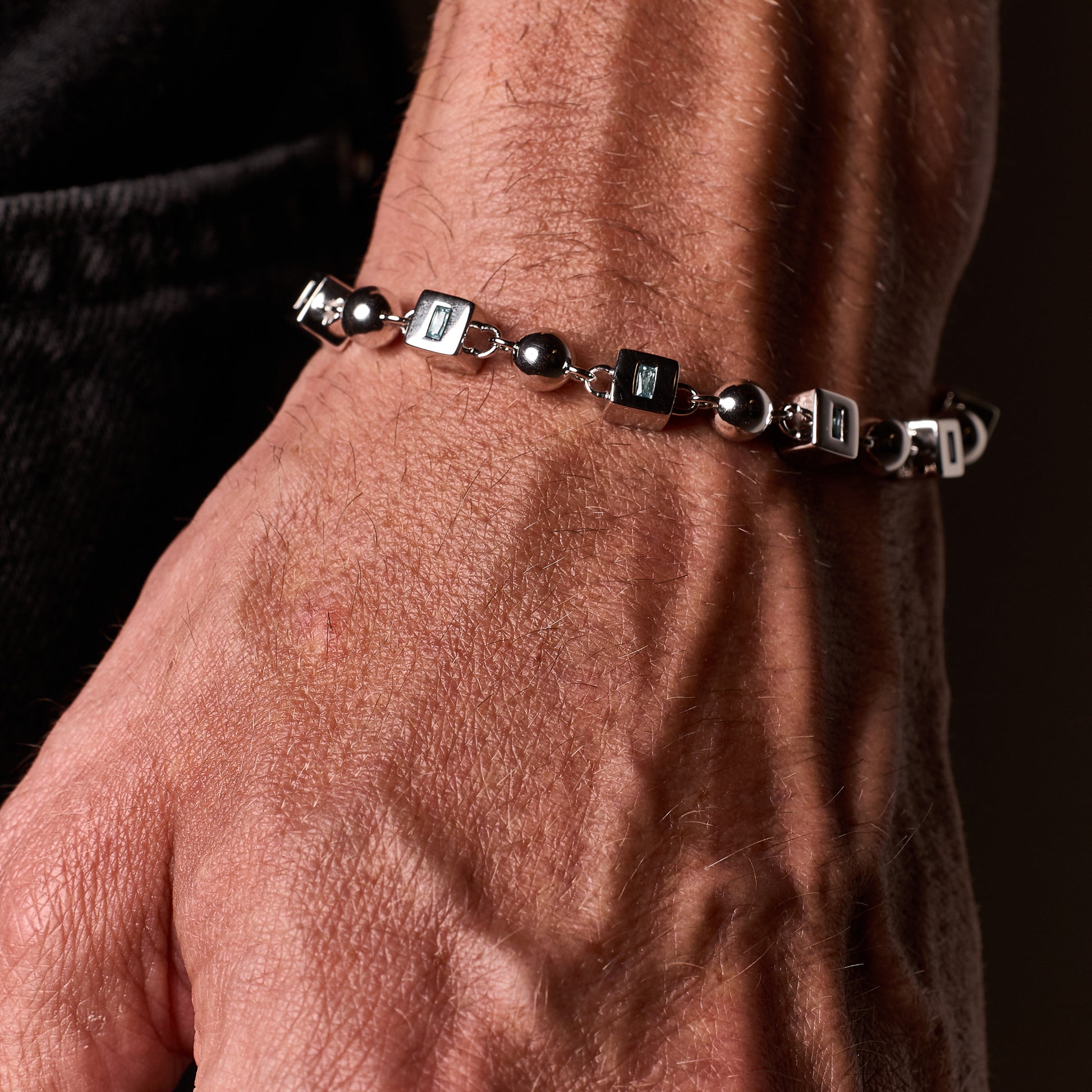 Closeup shot of man wearing Topaz Bracelet on wrist